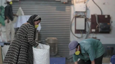 Lade collecting Garbage Stock-Footage 55439752