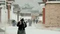 Ladies clean the streets at Labrang Monastery, China HD Footage