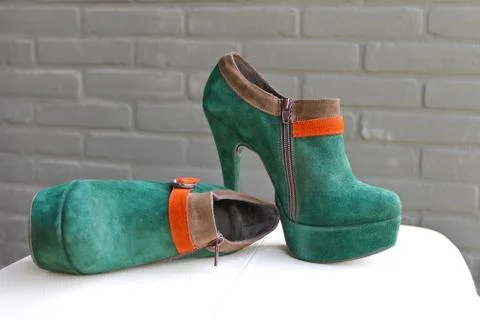 Ladies the green suede shoes on a heel and platform Stock Photos