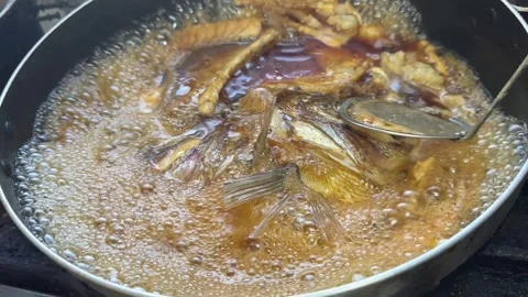 Ladle Taking Foam off a Fish Head Stew (Sea Bream Arani), Japanese Food Stock Footage 342663272