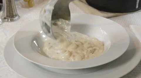 Ladling clam chowder into a bowl Stock Footage 47821987