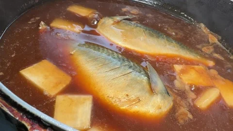 Ladling Miso Broth Over Simmering Mackerel Saba Misoni Izakaya Kitchen Japan Stock Footage 344633147