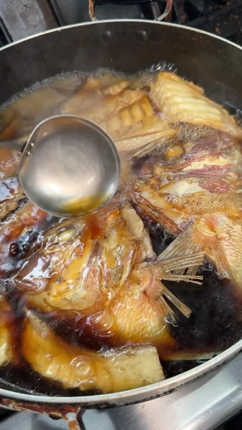 Ladling Soy Broth Over Simmering Sea Bream Ara, Izakaya Japan, Vertical 4K Stock Footage 345041503