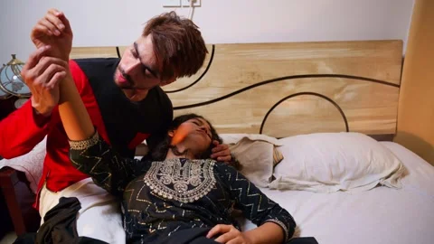 Lady already dead lying unresponsive in man arms over bed Stock-Footage 302071972