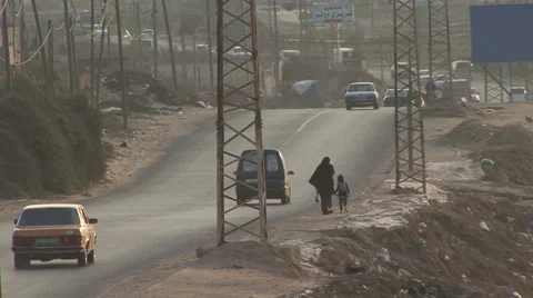 Lady and child on a middle-eastern road_Archive footage_2012 Stock Footage 43174032