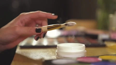 Lady applying make up setting powder on her face Stock Footage 322202092