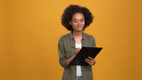 Lady assistant write paper tips tasks isolated mustard color background Stock Footage 166162107