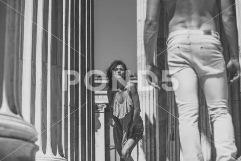 Lady attractives young macho on sunny day. Woman in turquoise dress walking Stock Photos