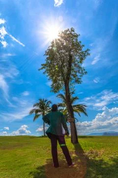 Lady behind the tree shadow Stock-Fotos