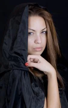 Lady in a black cape Stock Photos