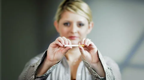 Lady breaks cigarette 2 Stock Footage 938961