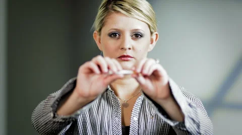 Lady breaks cigarette  3 Stock Footage 938959