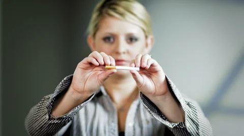 Lady breaks cigarette Stock Footage 938967