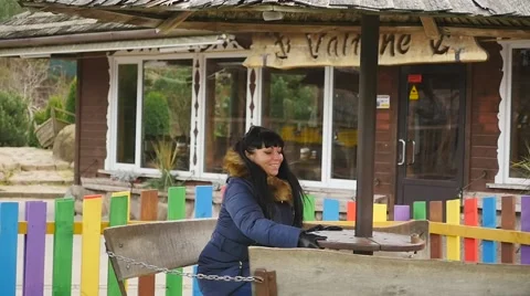 Lady on the carousel spinning itself Slow motion Stock Footage 44067895