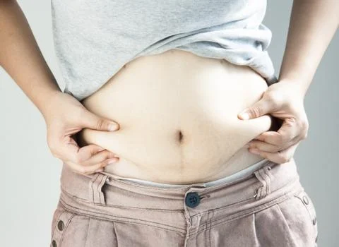 Lady catching abdominal surface Stock Photos
