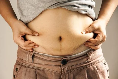 Lady catching abdominal surface Stock Photos