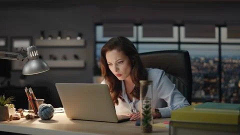 Lady chief staring computer screen panoramic windows cabinet closeup. Woman work Stock Photos
