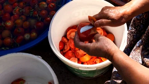 Lady chop tomatoes Stock Footage 118655589