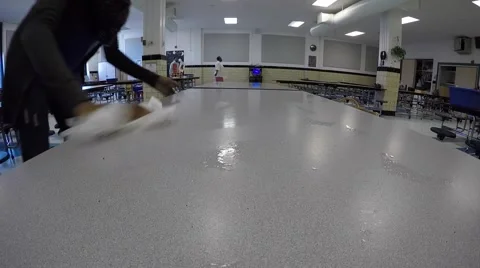 Lady Cleaning Cafeteria Table at School Stock Footage 50604263