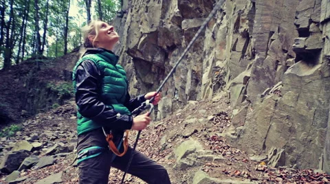 Lady climber secure a partner during climbing 스톡 동영상 56443655