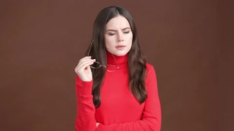 Lady contemplate decide solution decision isolated brown color background Stock Footage 189366426