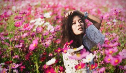 Lady in cosmos Stock Photos