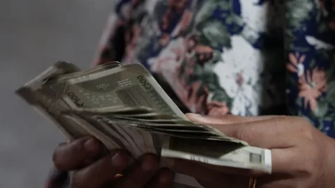 A lady is counting currency notes in close up Stock Footage 314607606
