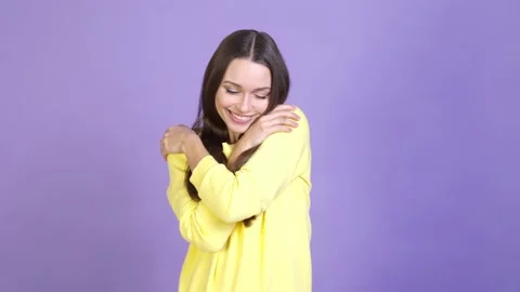 Lady cuddle hands shoulders laundry sweater isolated vivid color background Video stock 169998042