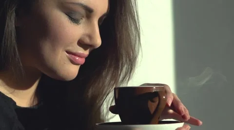 Lady with cup of steaming beverage. Stock Footage 50056980