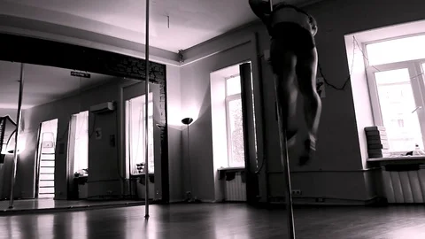 Lady Dancing On A Pole And Doing Art Tricks On The Front Camera View Stock Footage 90129244