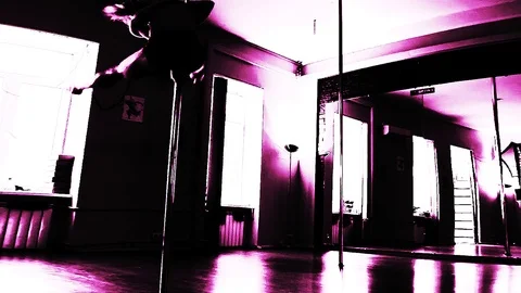 Lady Dancing On A Pole And Doing Tricks On The Front Camera View In Pink Stock Footage 90129252