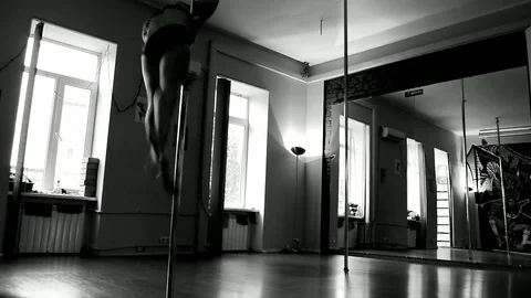 Lady Dancing On A Pole And Doing Tricks On The Front Camera View Stock Footage 90129254