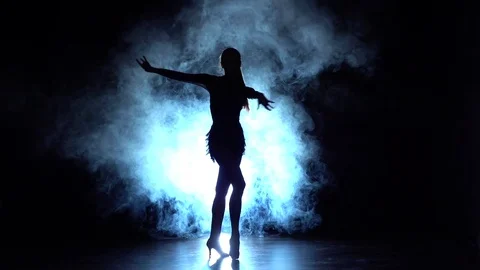 Lady dancing samba in the studio, silhouette. Slow motion Stock Footage