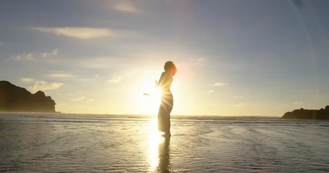 Lady dancing in sunflare Stock Footage 125417558