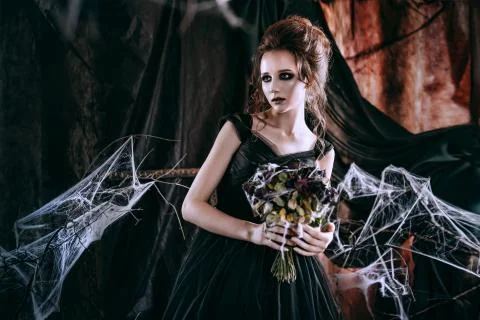 Lady in dark interior Stock Photos