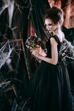 Lady in dark interior Stock Photos