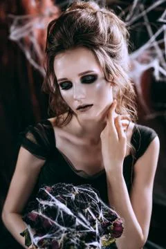 Lady in dark interior Stock Photos