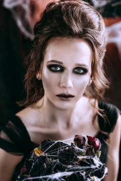 Lady in dark interior Stock Photos