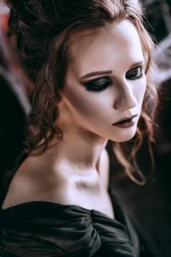 Lady in dark interior Stock Photos