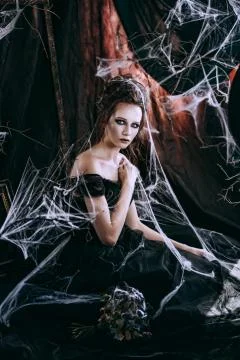Lady in dark interior Stock Photos