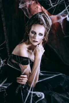 Lady in dark interior Stock Photos