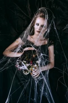 Lady in dark interior Stock Photos