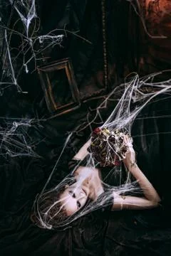 Lady in dark interior Stock Photos