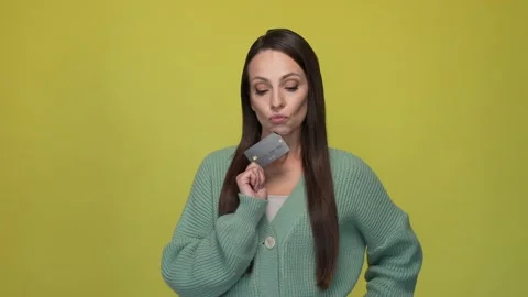 Lady decide perfect idea use debit card isolated lime color background Stock Footage 167361069