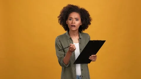 Lady do research customer write clip board isolated mustard color background Stock Footage 166162160