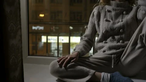 Lady is dreaming on window sill Video stock 86111633