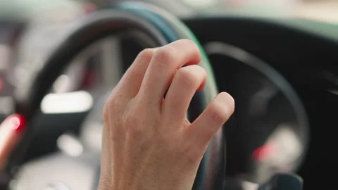 Lady driver holds steering wheel tapping fingers expectantly Vídeo Stock 237707149