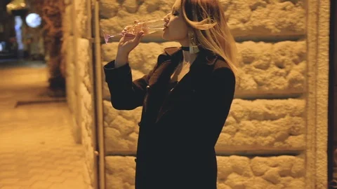 Lady enjoying time alone night city lights Stock Footage 106933930