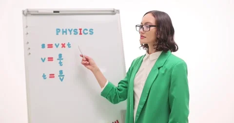 Lady explains distance formula giving physics lesson at school Stock Footage 321527172