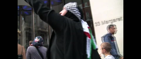 Lady with Flag at Huge Crowd Marching for Gaza on August 9 2014 London UK Stock Footage 144281706